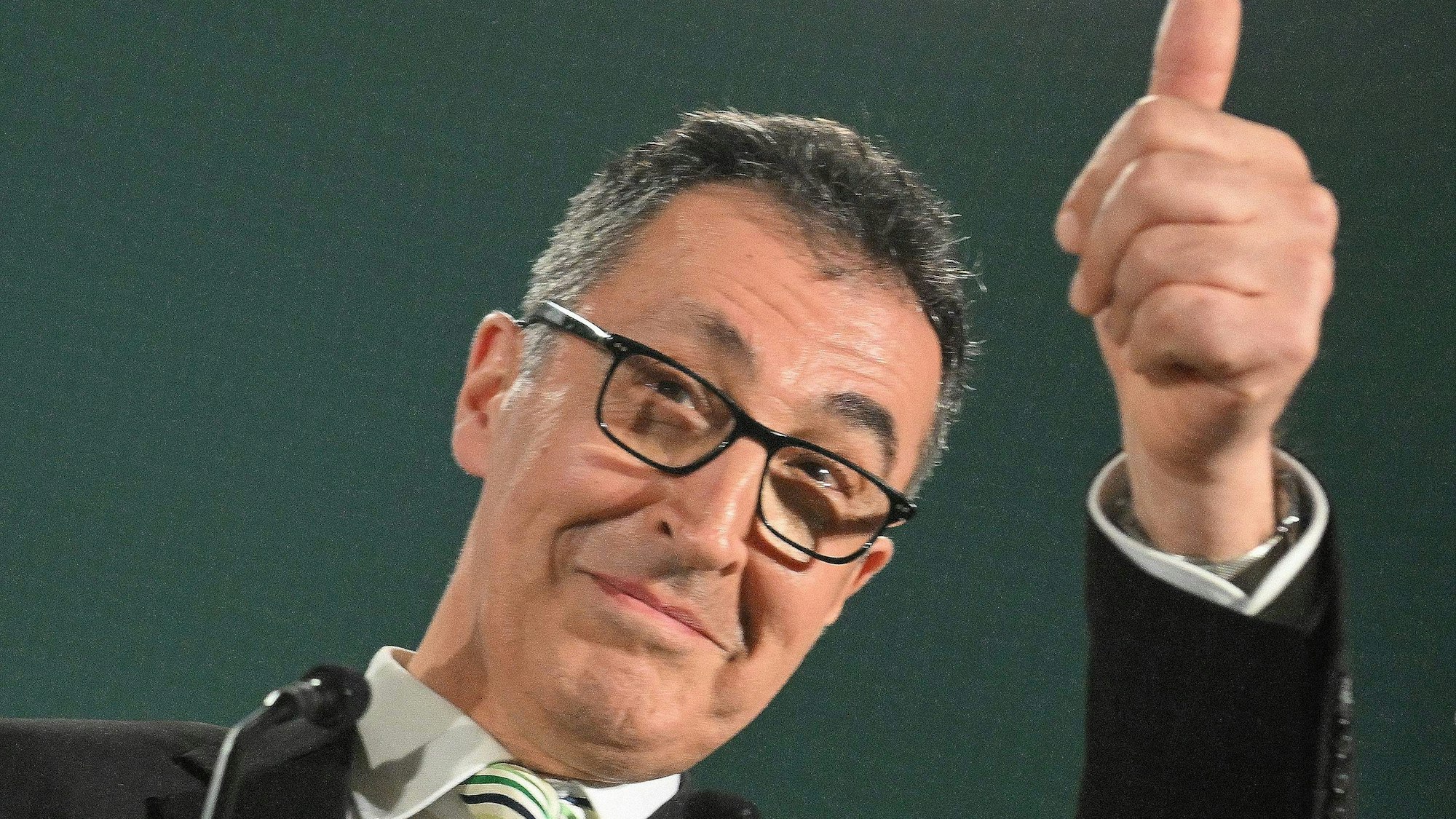 Cem Ozdemir, top candidate of the Greens addresses supporters after exit polls were announced in the state elections on March 8, 2026 in Stuttgart, southern Germany. The German Greens have beaten Chancellor Friedrich Merz's conservative CDU in a state election seen as a test for the German leader, according to exit polls. (Photo by THOMAS KIENZLE / AFP) / ALTERNATE CROP