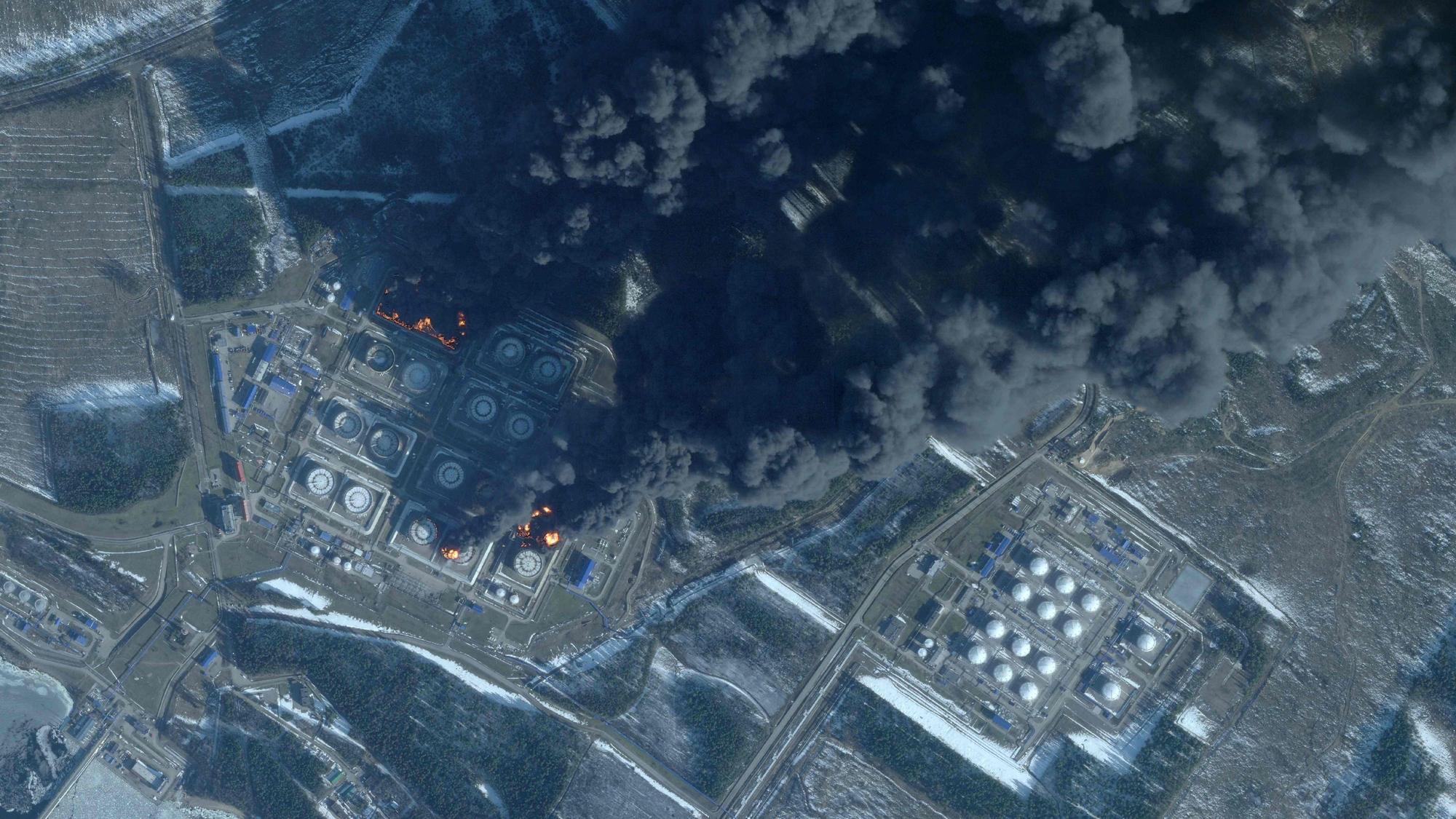 This handout satellite image taken on March 23, 2026 by Planet Labs PBC shows smoke rising from the Russian oil terminal at Primorsk, the most important Russian loading port in the Baltic Sea, following a drone attack claimed by Ukraine. The Russian port of Primorsk, near the Finnish border, suffered damage in the latest round of drone attacks, the region's governor announced on March 23, 2026, with Ukraine claiming responsibility. (Photo by 2026 Planet Labs PBC / AFP) / RESTRICTED TO EDITORIAL USE - MANDATORY CREDIT "AFP PHOTO / (C) 2026 PLANET LABS PBC " - HANDOUT - NO MARKETING NO ADVERTISING CAMPAIGNS - DISTRIBUTED AS A SERVICE TO CLIENTS