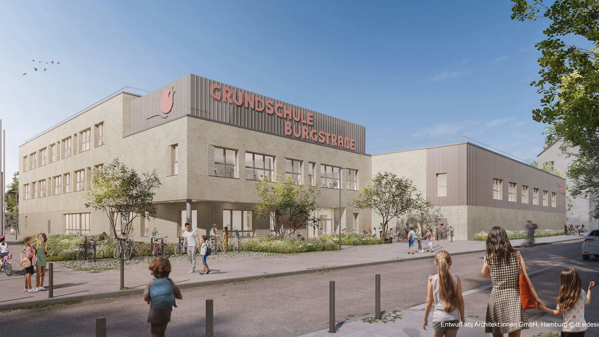 Ein Schulgebäude mit der großen Aufschrift Grundschule Burgstraße.