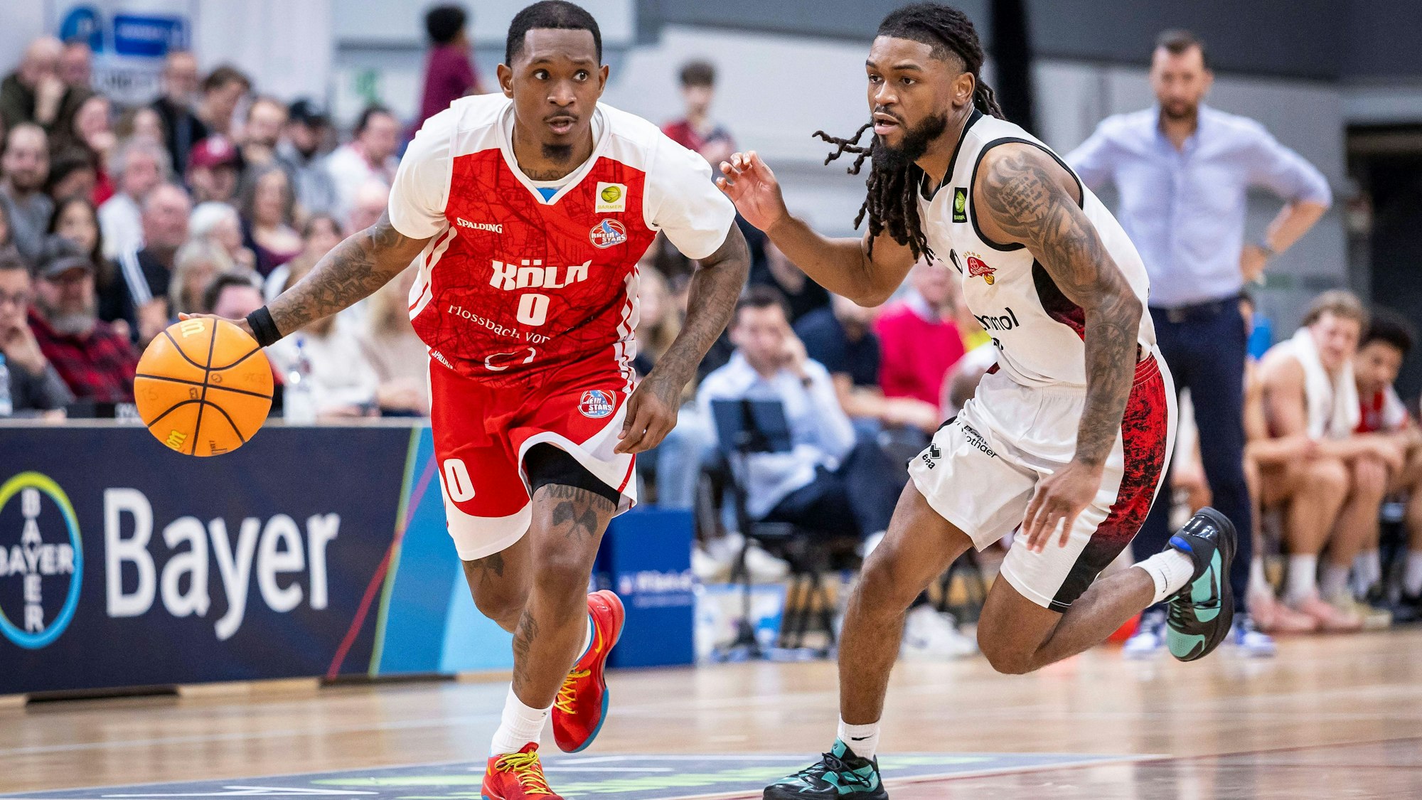 Barmer 2. Basketball Bundesliga ProA: Bayer Giants Leverkusen vs. RheinStars Koeln, 04.04.26 Leverkusen, 04.04.26 - Cedric Cezell Russell Jr. RheinStars Köln, 0 und Kobe Langley Bayer Giants Leverkusen, 8 während des Spiels der Barmer 2. Basketball Bundesliga ProA: Bayer Giants Leverkusen vs. RheinStars Koeln in der Ostermann Arena in Leverkusen. *** Barmer 2 Basketball Bundesliga ProA Bayer Giants Leverkusen vs RheinStars Koeln, 04 04 26 Leverkusen, 04 04 26 Cedric Cezell Russell Jr RheinStars Cologne, 0 and Kobe Langley Bayer Giants Leverkusen, 8 during the game of the Barmer 2 Basketball Bundesliga ProA Bayer Giants Leverkusen vs RheinStars Koeln at the Ostermann Arena in Leverkusen Copyright: xBEAUTIFULxSPORTS/LeahxKohringx