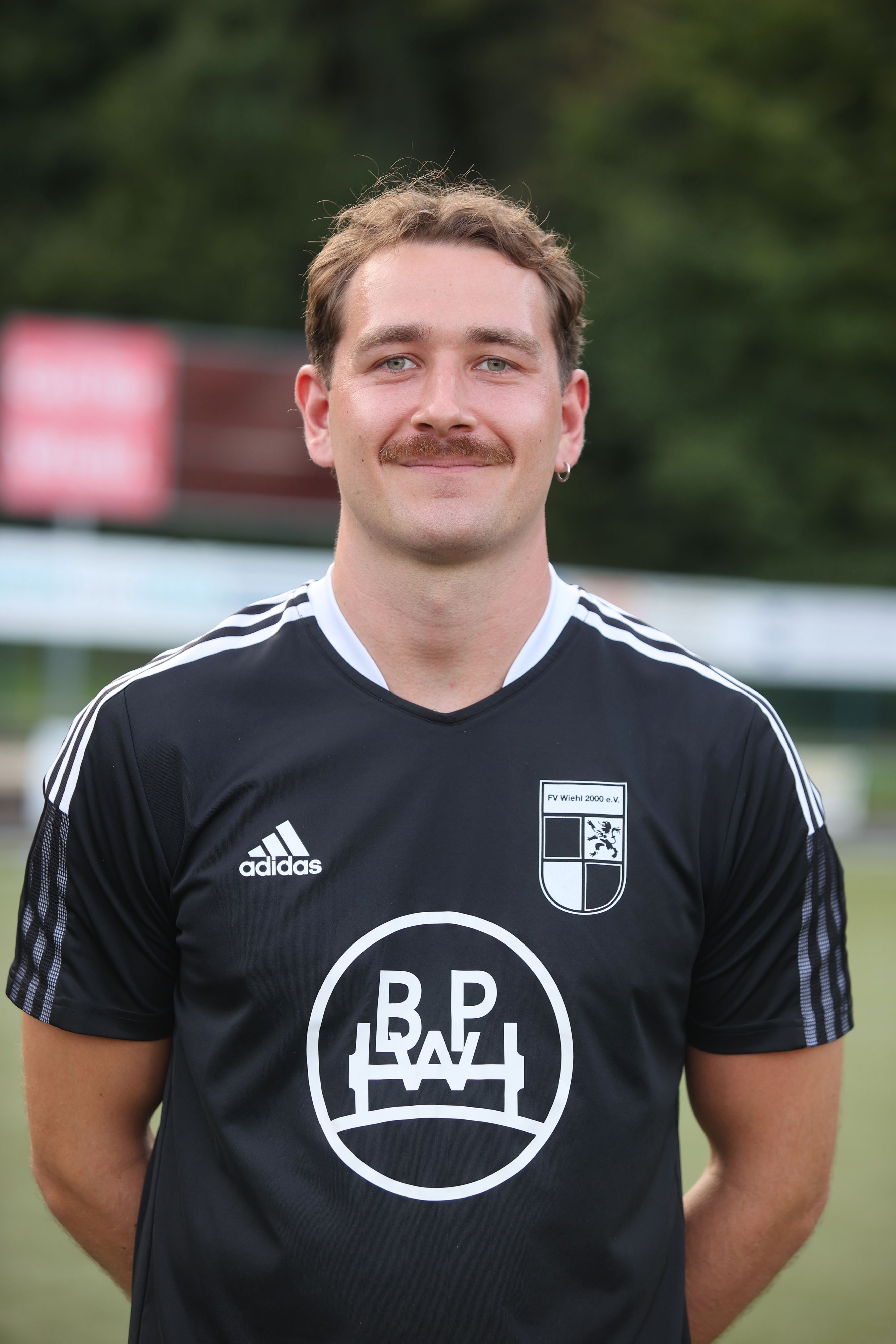 Porträt von einem lächelnden Vinzent Stoffel