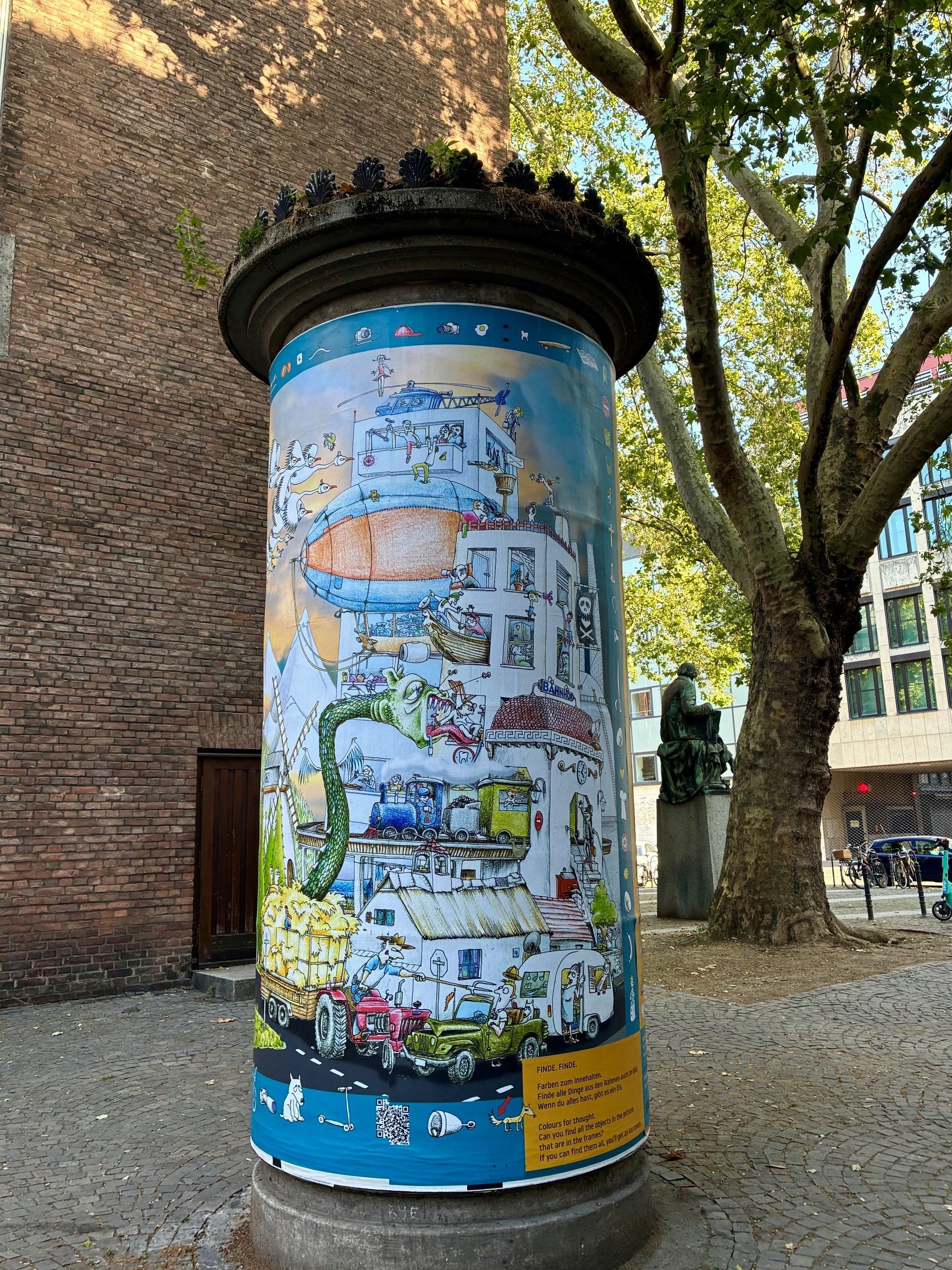 Finde.Finde: Ein Wimmelbild auf einer Kölner Litfaßsäule