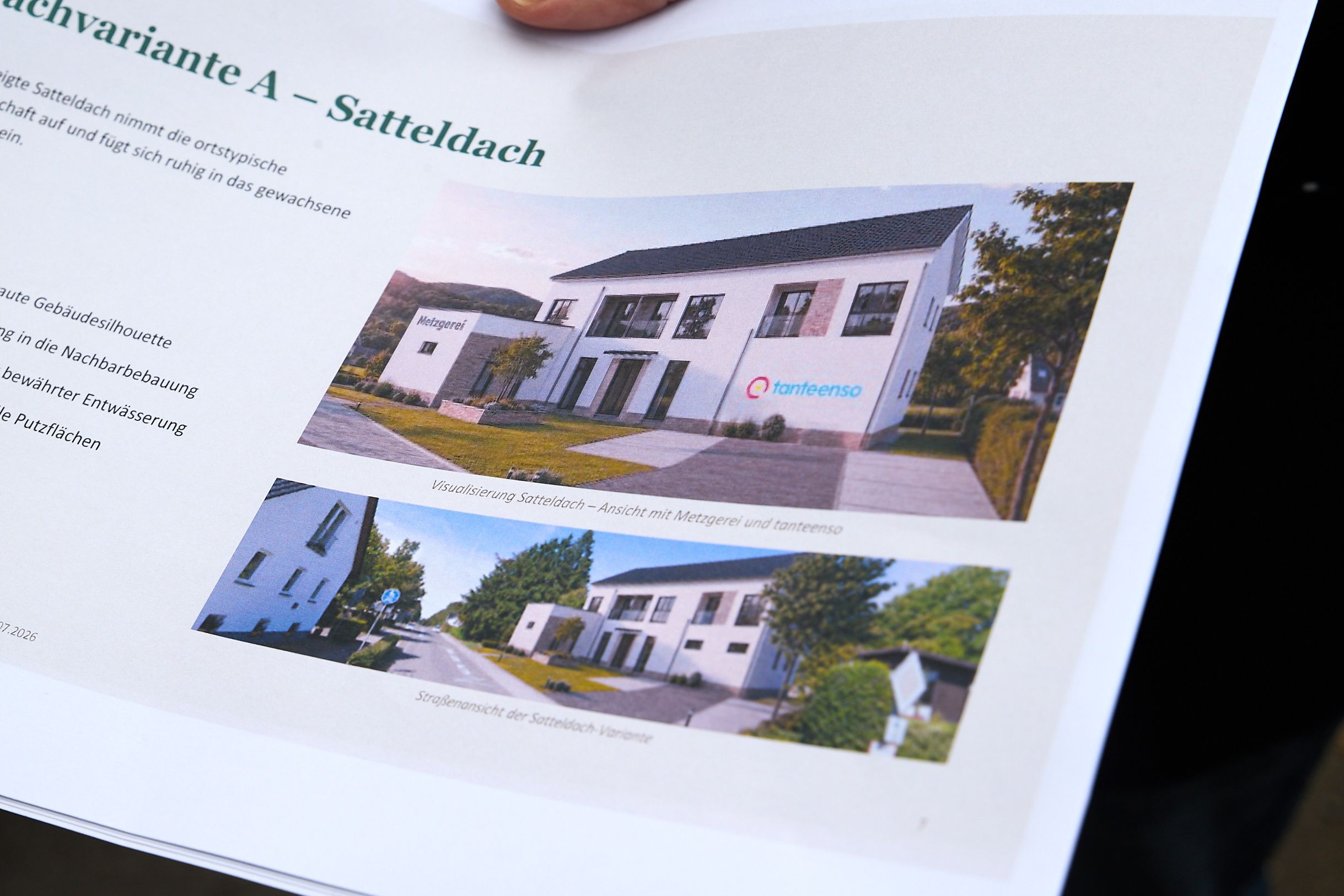 In einem Schriftstück sind zwei Visualisierungen des geplanten Gebäudes abgebildet.