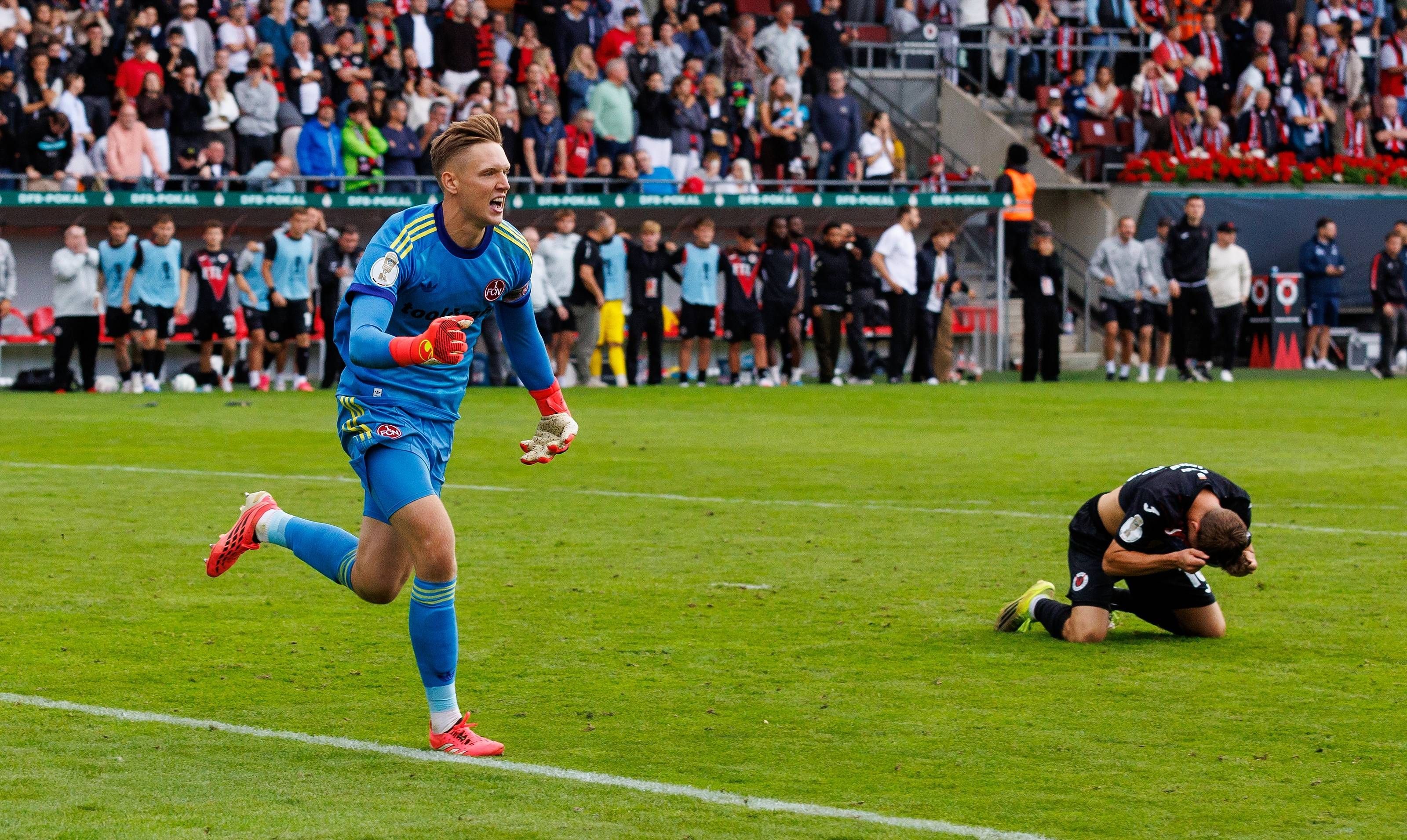 22.08.2026 - Fussball - Saison 2026 2027 - DFB Pokal Vereinspokal - 01. Runde: Viktoria Köln - 1. FC Nürnberg Nuernberg FCN  Club  - Sportfoto Zink / DaMa - xdaxmax - regulations prohibit any use of photographs as image sequences and/or quasi-video - Jubel Freude nach Spielende - Jan Reichert 1, 1. FC Nürnberg / FCN  jubelt Jubel nach gehaltenen Elfmeter im Elfmeterschießen - nach Sieg des FCN Niklas Jahn 16, FC Viktoria Köln  enttäuscht / Enttäuschung *** August 22, 2026 Soccer Season 20262027 DFB Cup Club Cup First Round Viktoria Cologne 1 FC Nuremberg Nuremberg FCN Club Sports Photo Zink DaMa xdaxmax regulations prohibit any use of photographs as image sequences and/or quasi-video celebrationsJubilation after the game Jan Reichert 1, 1 FC Nürnberg FCN celebrates Jubilation after a saved penalty in the penalty shootout following FCNs victory Niklas Jahn 16, FC Viktoria Köln disappointed Disappointment