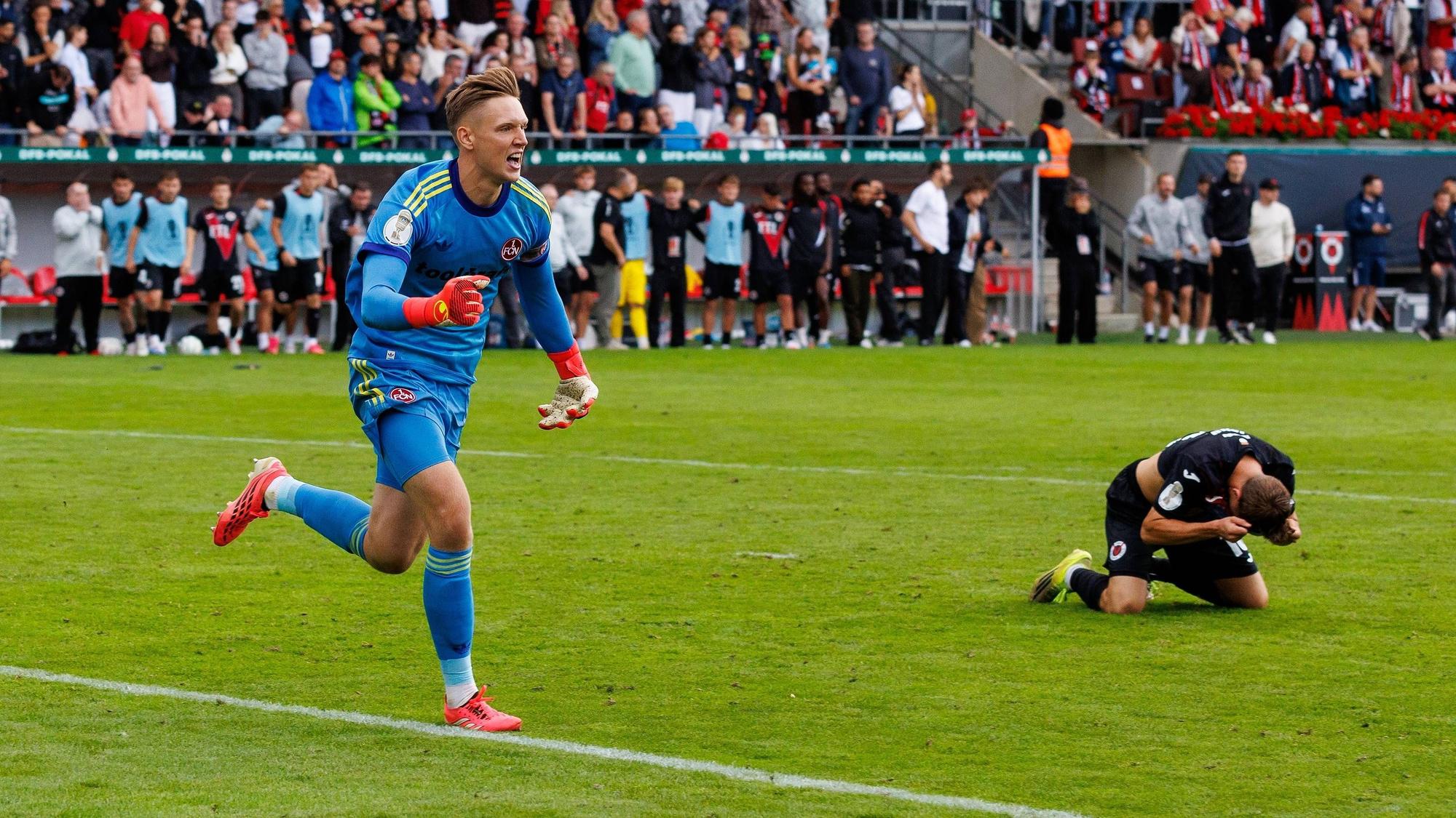 22.08.2026 - Fussball - Saison 2026 2027 - DFB Pokal Vereinspokal - 01. Runde: Viktoria Köln - 1. FC Nürnberg Nuernberg FCN Club - Sportfoto Zink / DaMa - xdaxmax - regulations prohibit any use of photographs as image sequences and/or quasi-video - Jubel Freude nach Spielende - Jan Reichert 1, 1. FC Nürnberg / FCN jubelt Jubel nach gehaltenen Elfmeter im Elfmeterschießen - nach Sieg des FCN Niklas Jahn 16, FC Viktoria Köln enttäuscht / Enttäuschung *** August 22, 2026 Soccer Season 20262027 DFB Cup Club Cup First Round Viktoria Cologne 1 FC Nuremberg Nuremberg FCN Club Sports Photo Zink DaMa xdaxmax regulations prohibit any use of photographs as image sequences and/or quasi-video celebrationsJubilation after the game Jan Reichert 1, 1 FC Nürnberg FCN celebrates Jubilation after a saved penalty in the penalty shootout following FCNs victory Niklas Jahn 16, FC Viktoria Köln disappointed Disappointment