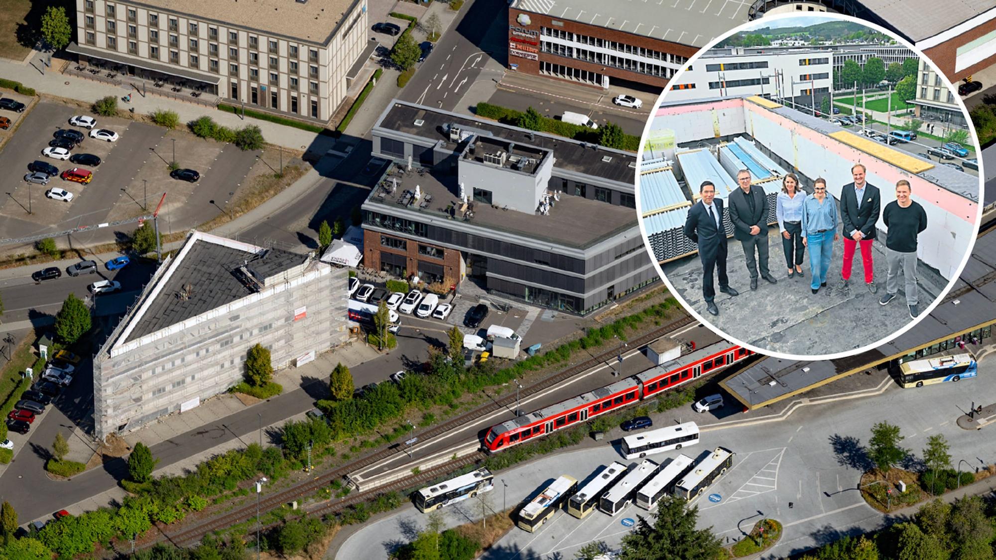Das neue Prisma (links) schließt sich gleich an die Halle 51 an. Gestern feierten Bauherr und Mieter mit der Stadt Richtfest.