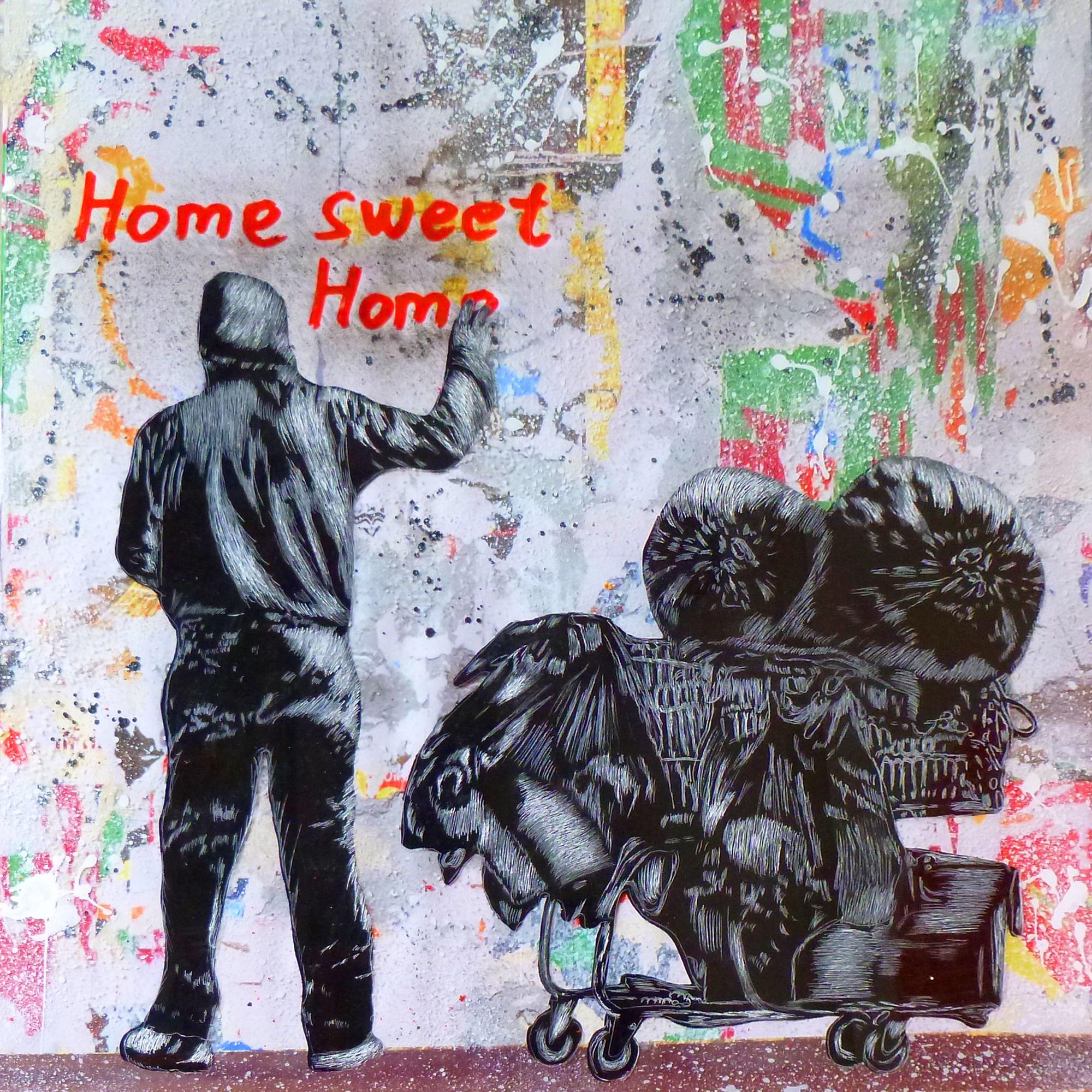 Ein Mann sprüht den Schriftzug Home sweet Home auf eine Wand.