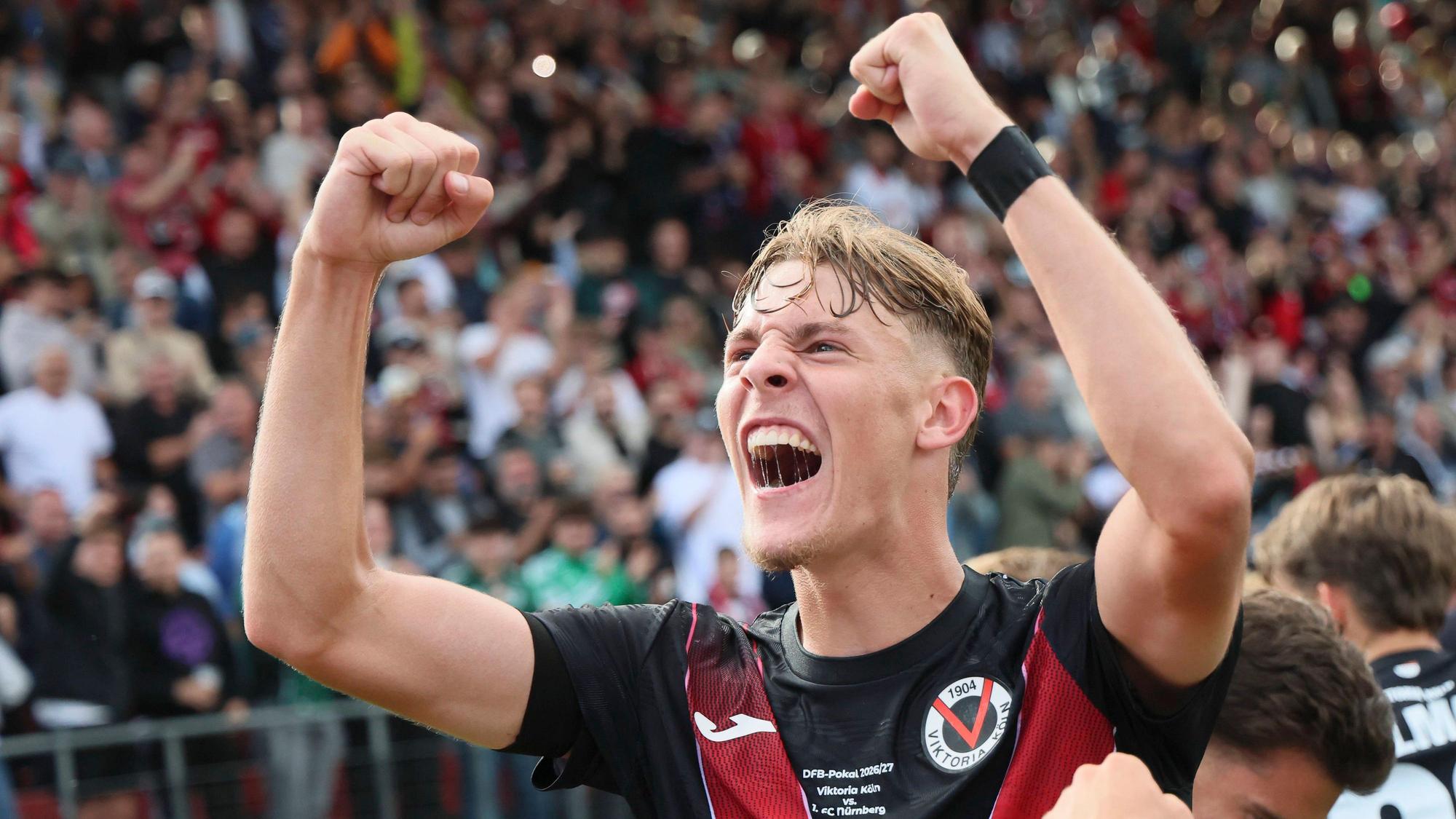 KOELN, GERMANY - AUGUST 22, 2026: Niklas Swider Viktoria Koeln, 20 celebrates the 1:1 after a goal of Meiko Sponsel Viktoria Koeln, 19 during the DFB-Cup match between Viktoria Koeln vs. 1. FC Nuernberg at the Sportpark Hoehenberg on August 22, 2026 in Koeln, Germany. DFL REGULATIONS PROHIBIT ANY USE OF PHOTOGRAPHS AS IMAGE SEQUENCES AND/OR QUASI-VIDEO. Nordrhein-Westfalen Germany Copyright: xAxelxKohringx