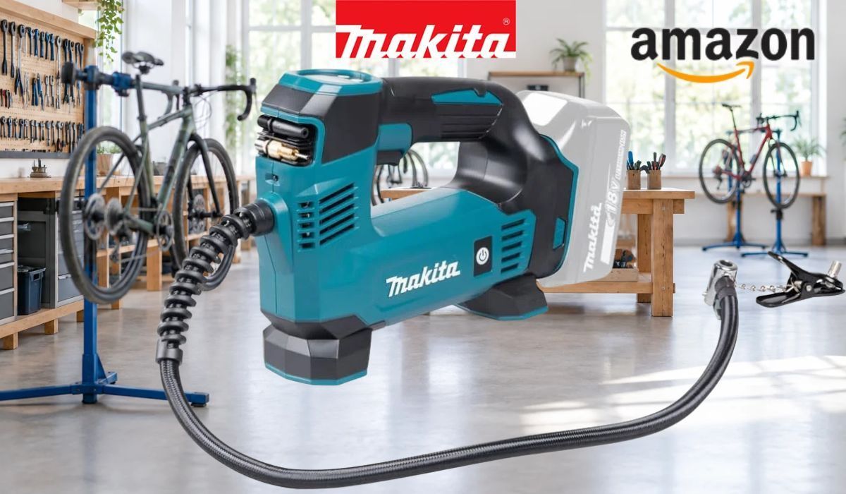 Makita DMP180Z Akku-Kompressor vor heller, lichtdurchfluteter Fahrradwerkstatt im Hintergrund.