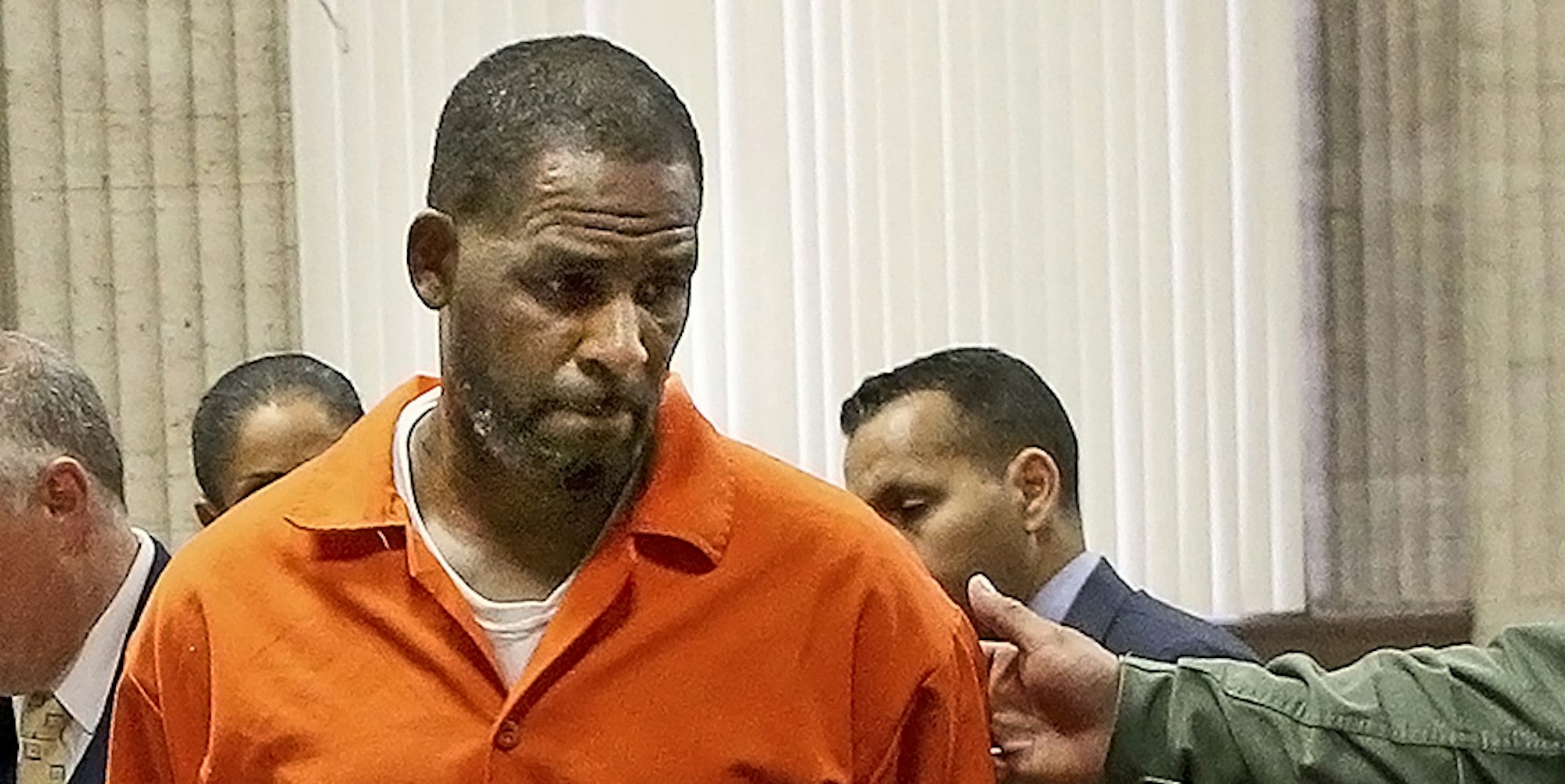 R Kelly orange jacket