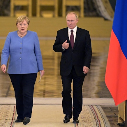 Putin Merkel afp