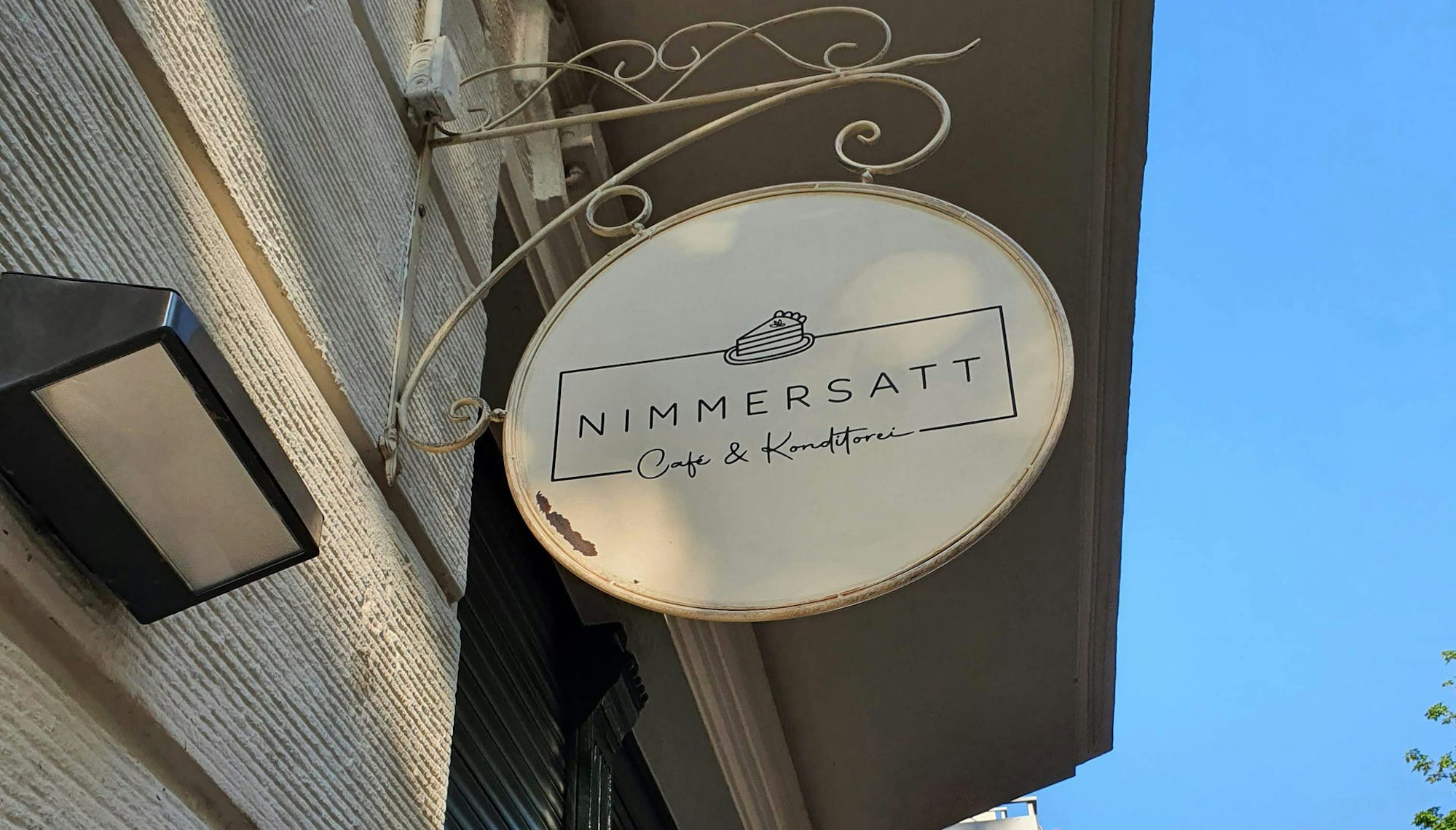 cafe nimmersatt schild